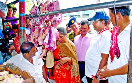 DSCC Mayor Sayeed Khokon visiting the city's kitchen markets including beef shops to check price hike of essentials ahead of Holy Ramzan. This photo was taken from New Market area on Saturday.