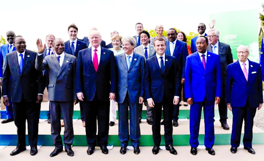 Front row, L-R: Kenya's President Uhuru Kenyatta, Guinea's President Alpha Conde, U.S. President Donald Trump, Italian Prime Minister Paolo Gentiloni, French President Emmanuel Macron, Niger's President Mahamadou Issoufou and Tunisian President Beji Ca