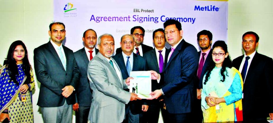 Hassan O. Rashid, Additional Managing Director of Eastern Bank Limited and Syed Hammadul Karim, Vice President of MetLife Bangladesh exchanging an agreement signing documents in the city recently. Under the deal, Commercial and SME Banking Customers of th