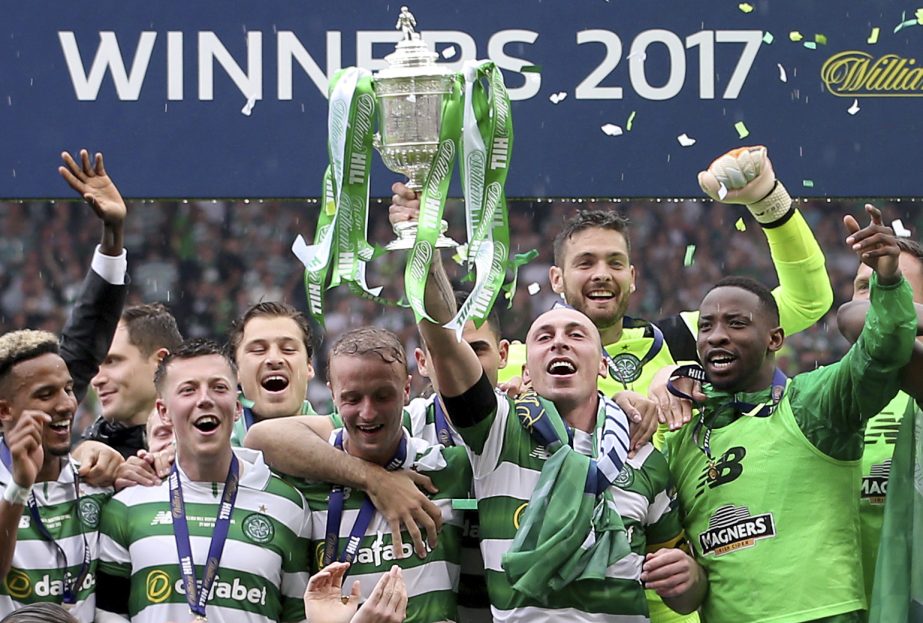 Celtic's players celebrate after winning the Scottish Cup final against Aberdeen at Hampden Park, Glasgow, Scotland on Saturday.