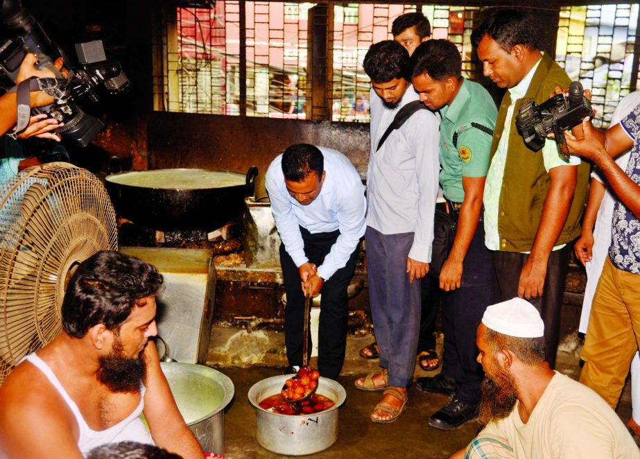 A mobile court of Dhaka Metropolitan Police during separate raids in the city on Sunday fined Bombay and Alauddin Sweetmeats Tk 2 lakh on charges of selling and preparing sweetmeats in unhygienic condition. This photo was taken from the city's Chalk Baza