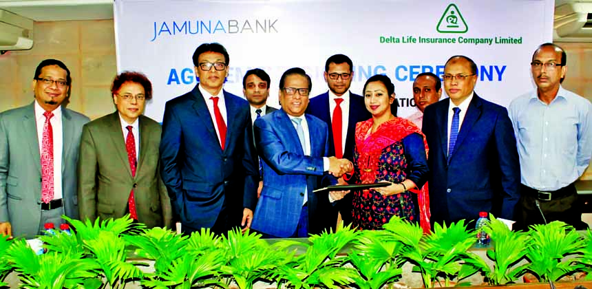 Shafiqul Alam, Managing Director of Jamuna Bank Limited and Adeeba Rahman, CEO (CC) of Delta Life Insurance Company Limited exchanging an agreement signing documents at the bank head office in the city recently. Under the deal, Jamuna Bank employees will