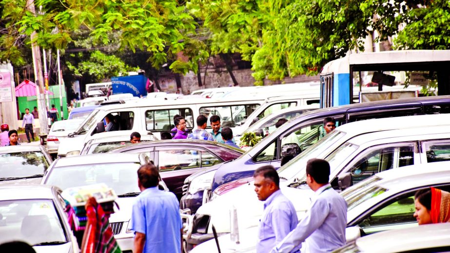 City footpaths remain occupied with illegal parking again despite DCC's restriction causing sufferings to commuters as well on the second day of holy month of Ramzan on Monday. This photo was taken from in front of the Bangladesh Secretariat.