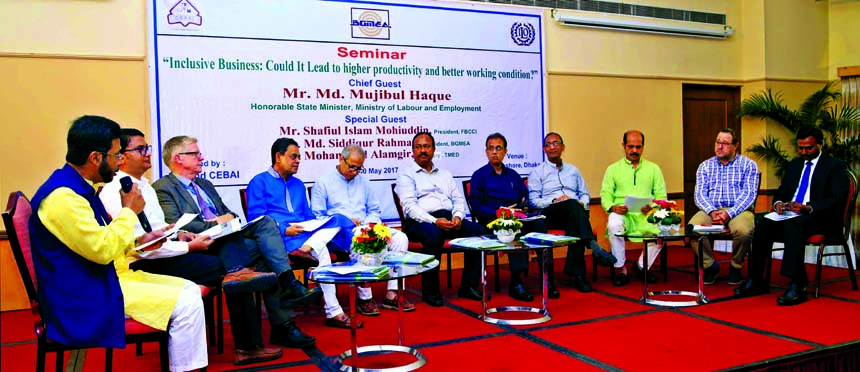 State Minister for Labour and Employment, Md Mujibul Haque Chunnu, presiding over a seminar on "Inclusive Business: Could it lead to higher productivity and better working conditions?" at a city hotel on Tuesday. FBCCI President Shafiul Islam Mohiuddin,