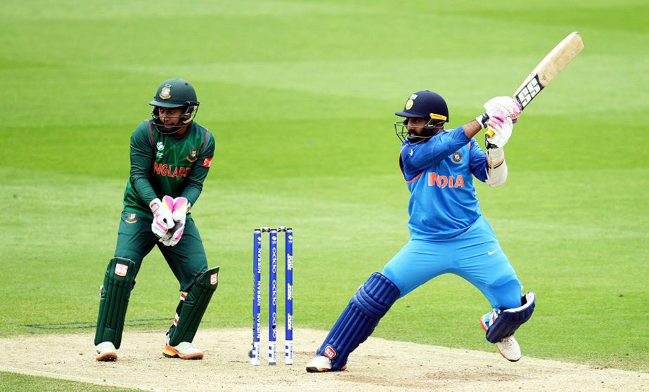 Dinesh Karthik of India bats during the ICC Champions Trophy Warm-up match between India and Bangladesh at the Oval in London, England on Tuesday.