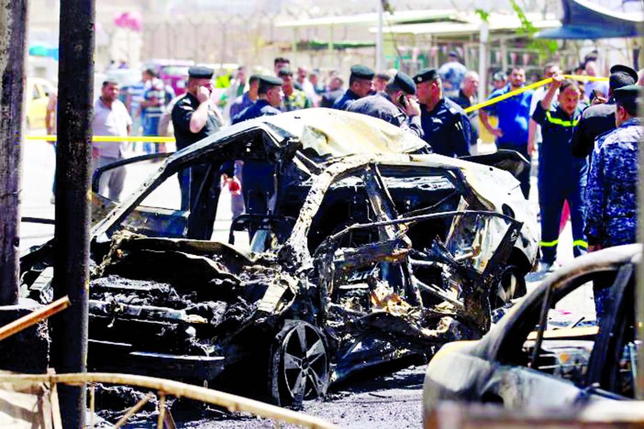 A wreckage of a car is seen at the site of car bomb attack near a government office in Karkh district in Baghdad.