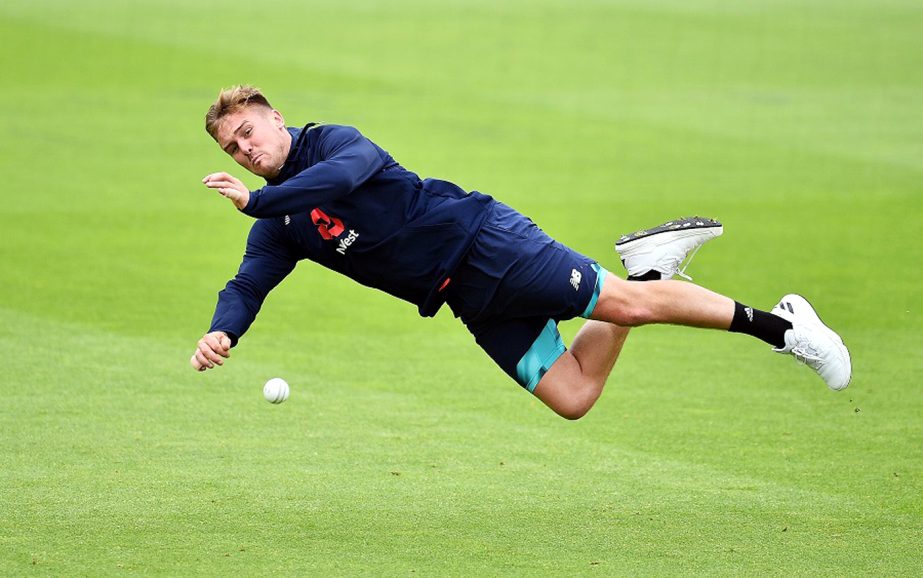 England's Jason Roy dives to catch a ball during their nets practice session at The Oval in London on May 31, 2017, on the eve of their ICC Champions Trophy cricket match against Bangladesh.