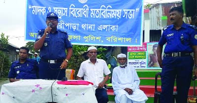 BANARIPARA(Barisal): Md Sajjad Hossain, Officer-in-Charge, Banaripara Upazila speaking at a view exchange meeting against militancy and drug abuse recently.