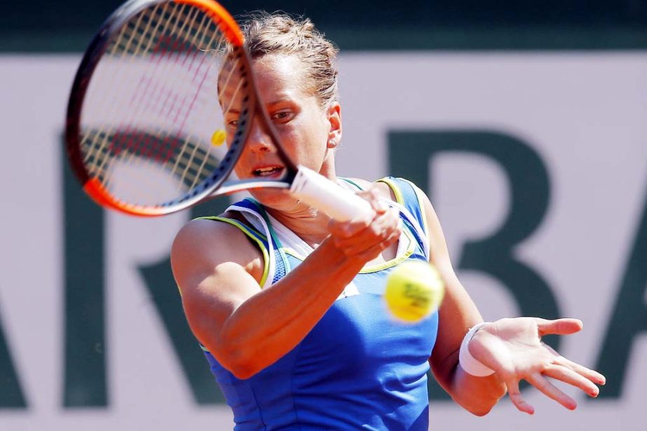 Barbora Strycova of Czech Republic returns the ball to France's Alize Cornet during their second round match of the French Open tennis tournament at the Roland Garros stadium, Thursday.