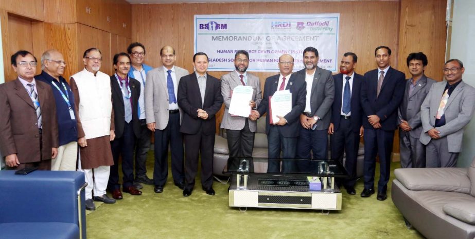 Md. Musharrof Hossain, President, BSHRM and Prof Dr Farid A Sobhani, Director, HRDI exchanging the documents regarding ACCHRM course in presence of the Chairman of Board of Trustees of Daffodil International University Md. Sabur Khan, its Vice Chancellor