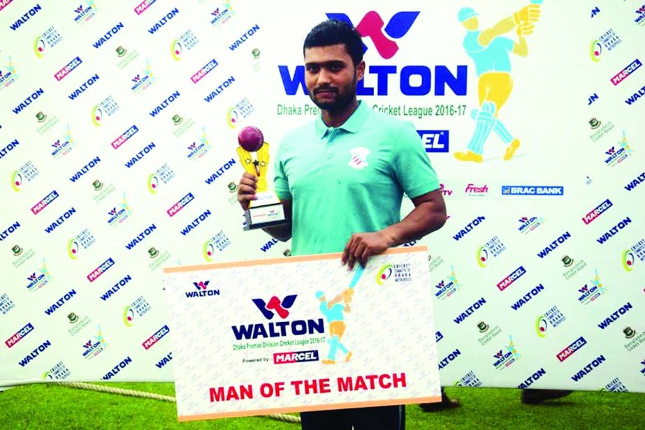 Mehedi Maruf of Prime Bank Cricket Club poses with the Man of the Match award at the BKSP ground No 4 in Savar on Friday.
