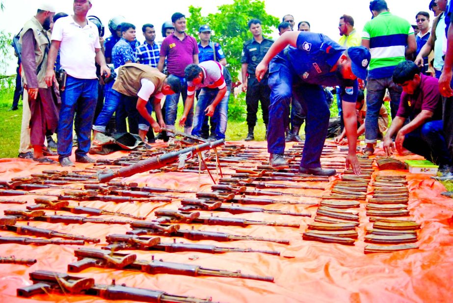 Police on information recovered huge arms and ammo including explosives from a canal at Purbachal in N'ganj on Friday.