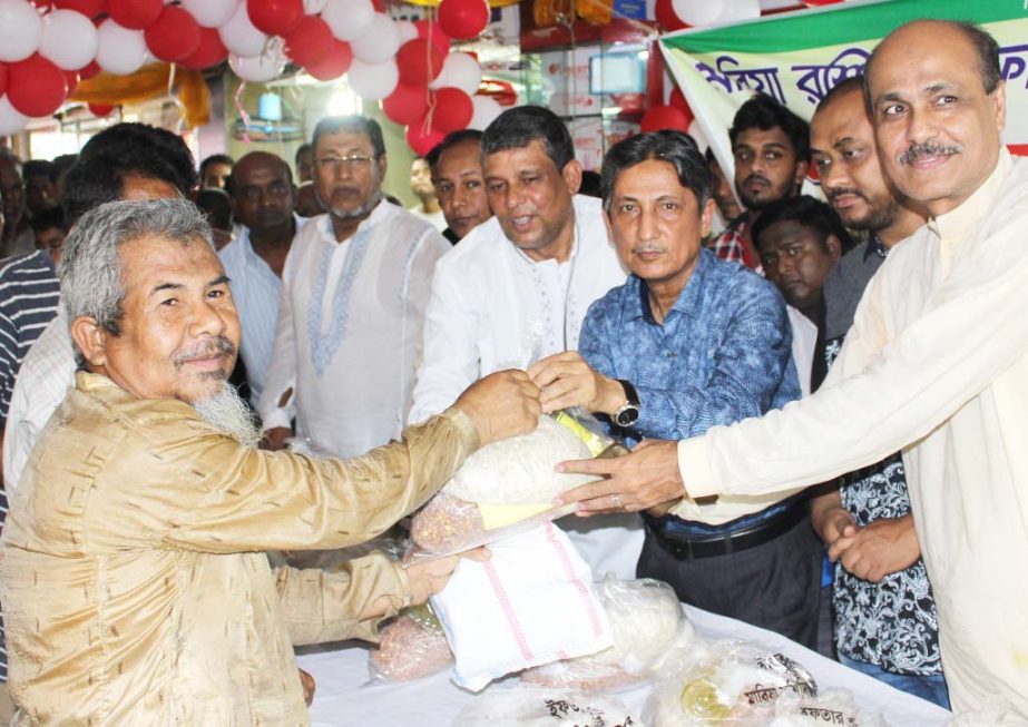 Chairman of Chittagong Development Authority (CDA) distributing Iftar items among the poor at Al Koron Ward in the city on Thursday organised by Mabia Rashidia Foundation. Ward Councillor Tareq Solaiman and CDA Board Member BM Shajahan were also presen