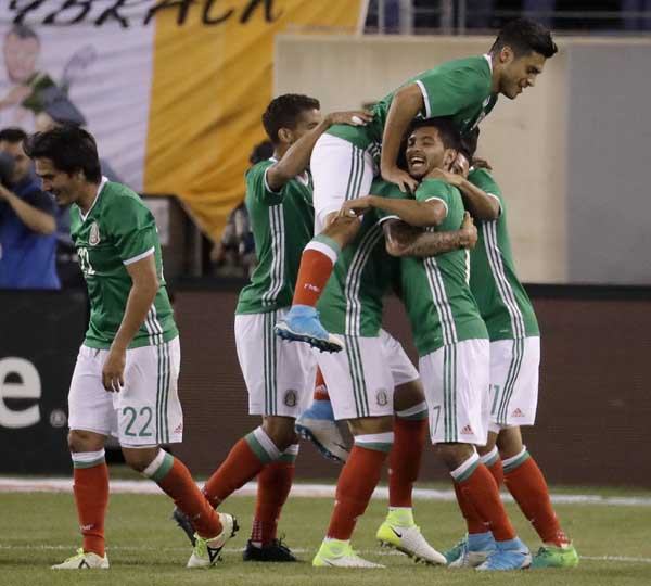 Mexico players celebrate after Jesus Corona scored a goal against Ireland during the first half of an international friendly soccer match at MetLife Stadium in East Rutherford, NJ on Thursday.