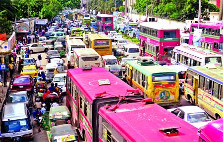 Thousands of vehicles got stuck in a traffic gridlock in different city areas causing sufferings to commuters. This photo was taken from Shahbagh intersection on Saturday.