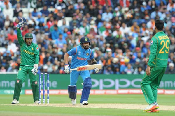 Indian cricket captain Virat Kohli takes a run during the ICC Champions Trophy match between India and Pakistan at Edgbaston in Birmingham, England on Sunday.