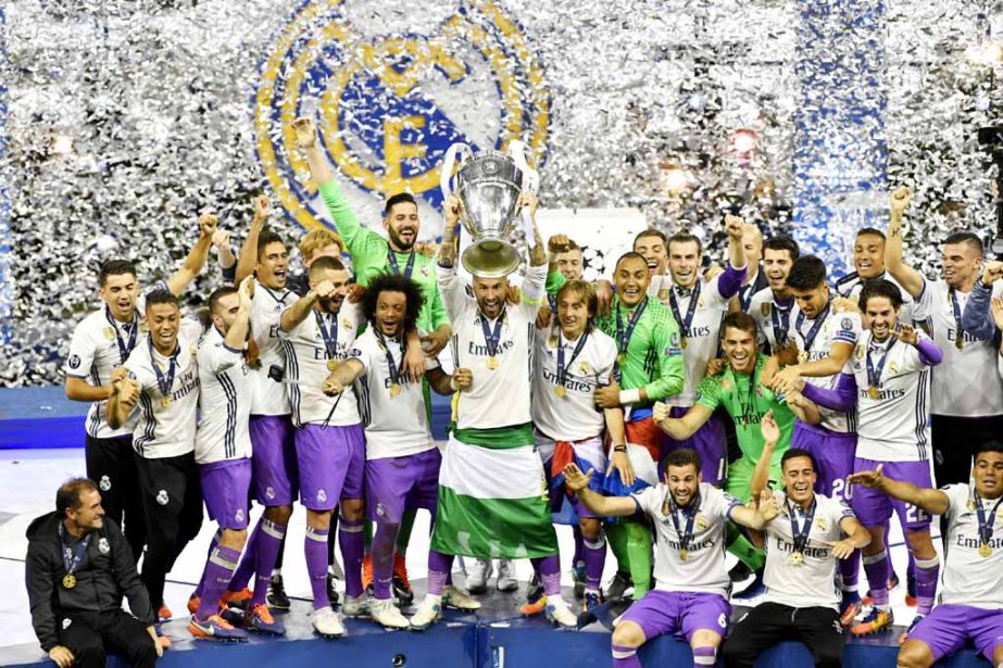 Real Madrid's Sergio Ramos raises the trophy to celebrate winning the Champions League final against Juventus at the Millennium Stadium in Cardiff, Wales on Saturday.