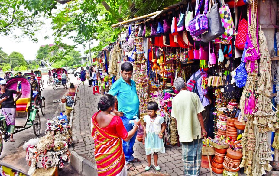 The footpaths in front of the Curzon Hall of DU and Bangladesh Shishu Academy occupied by Pottery outlets are still untouched despite DSCC struggling to clean the city from illegal occupation, causing sufferings to commuters as well as students movement i