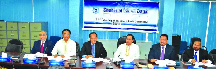Mosharraf Hossain Chowdhury, Chairman, Board of Audit Committee of Shahjalal Islami Bank Limited, presiding over the 194th meeting at the bank's head office in the city on Monday. Farman R Chowdhury, Managing Director, Abdul Halim, Mohammed Golam Quddus