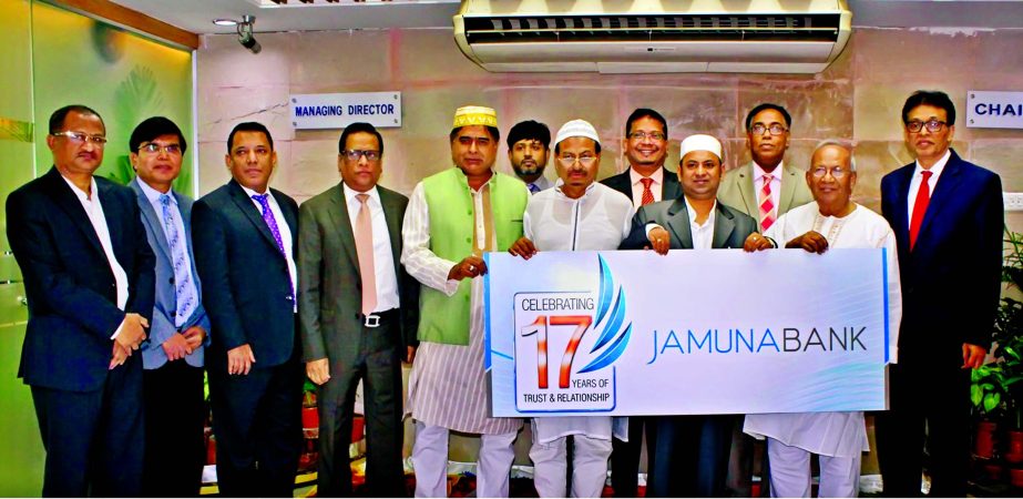 Md Ismail Hossain Siraji, Chairman, Jamuna Bank Limited, Nur Mohammed, Chairman of the bank Foundation, Sirajul Islam Varosha, Director of the Board, Shafiqul Alam Managing Director of the bank, celebrating its 17th founding anniversary at the bank's he