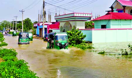 About one hundred villages of Moulvibazar Upazila were inundated by flash-flood due to heavy rain. This photo was taken on Tuesday.