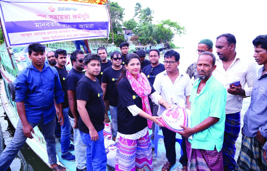 KISHOREGANJ: Rice distributed among the families of flood -hit people at Etna Upazila organised by Service Engine BPO, a IT Outsourcing company recently.