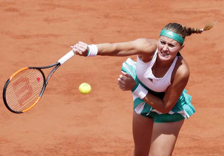 France's Kristina Mladenovic serves the ball to Timea Bacsinszky of Switzerland during their quarterfinal match of the French Open tennis tournament at the Roland Garros stadium in Paris on Tuesday.