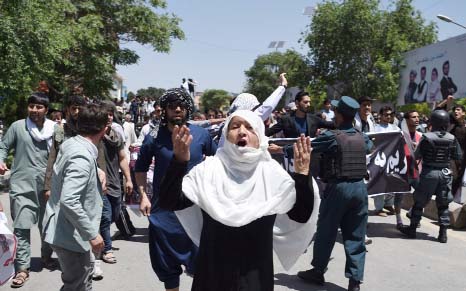 Afghan protesters shout anti-government slogans during a protest against the government following a catastrophic truck bomb attack near Zanbaq Square in Kabul.