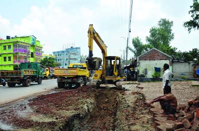 SHERPUR(Bogra): Soils sale are going on by making drains on Dhaka- Bogra Highway in the name to solve water logging problems. The picture was taken on Thursday.