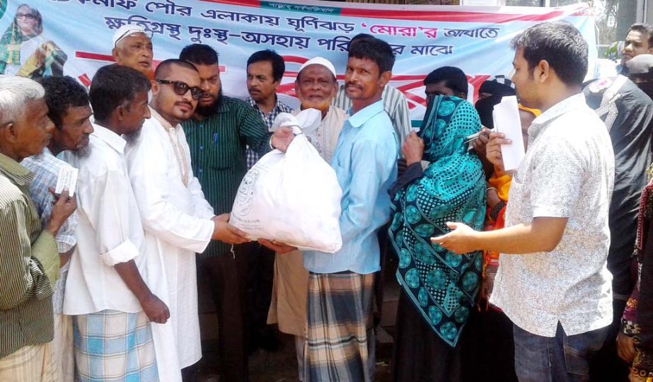 Md Ismail, Mayor, Teknaf Pourashava distributing relief materials among the Mora victims on Wednesday