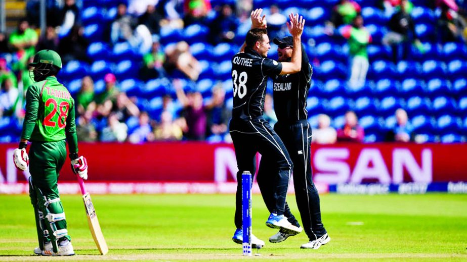 Tim Southee celebrates after dismissing Tamim Iqbal in the first over during the ICC Champions Trophy match between New Zealand and Bangladesh at SWALEC Stadium in Cardiff, Wales on Friday.