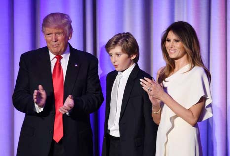Then-U.S. President-elect Donald Trump arrives with his son Barron and wife, Melania, at the New York Hilton Midtown on Nov. 8.