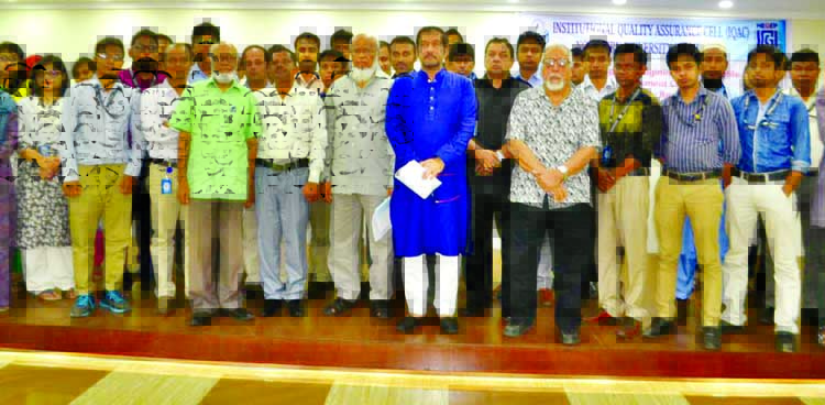 Participants at a workshop on "Designing Course Profile and Assessment Criteria and Orientation of New Faculty Members"" of Institutional Quality Assurance Cell (IQAC) of Northern University Bangladesh pose for a photo on Sunday."
