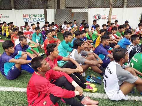 The participants of the trial session of Bangladesh Under-18 Football team listening to the instructors (not in the picture) at the Bir Shreshtha Shaheed Sepoy Mohammad Mostafa Kamal Stadium in Kamalapur on Sunday.