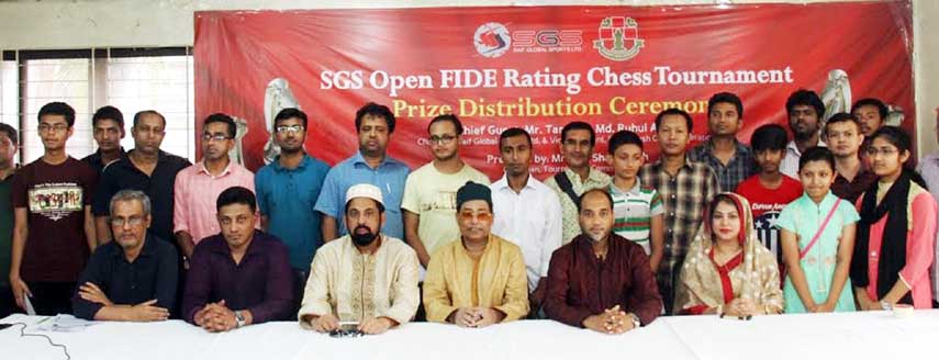 The winners of the Saif Global Sports (SGS) Open FIDE Rating Chess Tournament with the guests and officials of Bangladesh Chess Federation pose for photograph at the playing room of National Sports Council on Saturday.