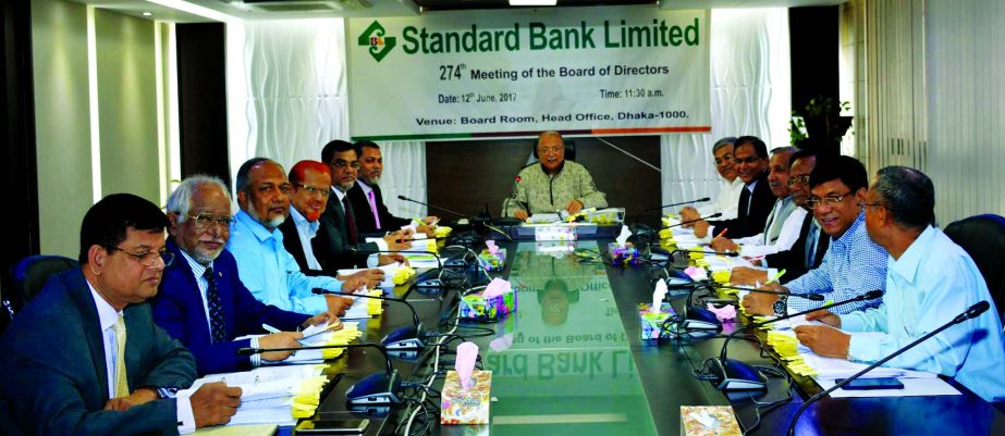 Kazi Akram Uddin Ahmed, Chairman, Board of Directors of Standard Bank Ltd. presiding over the 274th meeting at the bank head office in the city on Monday. Mamun-Ur-Rashid, Managing Director, SAM Hossain, Vice-Chairman, Kamal Mostafa Chowdhury, Ferozur Rah