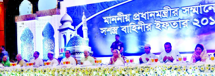 Prime Minister Sheikh Hasina along with other distinguished persons offering munajat at an Iftar Mahfil organised by Armed Forces at Senamalancha in Dhaka Cantonment on Monday. PMO photo