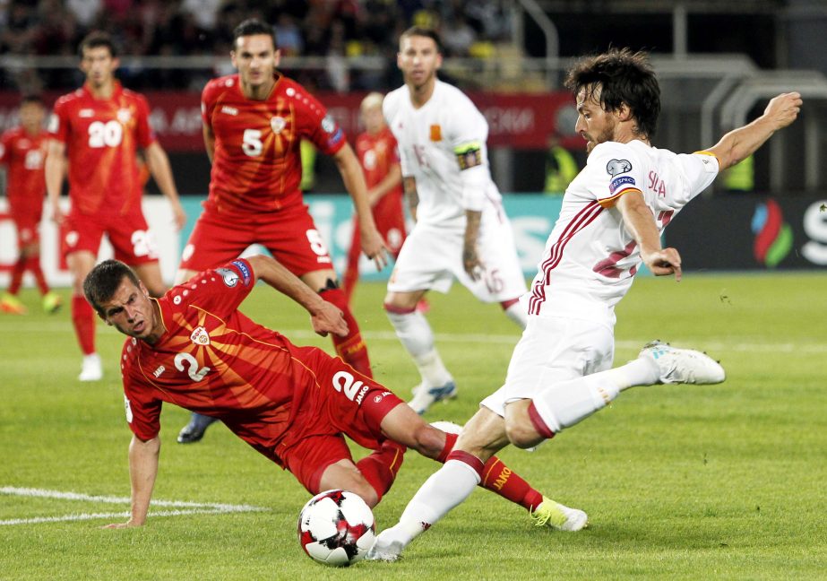 Spain's David Silva (right) kicks the ball past Macedonia's Kristijan Tosevski during their World Cup Group G qualifying soccer match at the Philip II National Stadium in Skopje, Macedonia on Sunday.