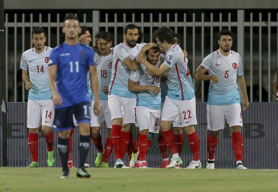 Turkey players celebrate after a goal during their World Cup Group I qualifying soccer match against Kosovo at Loro Borici Stadium, in Shkoder, northern Albania on Sunday.