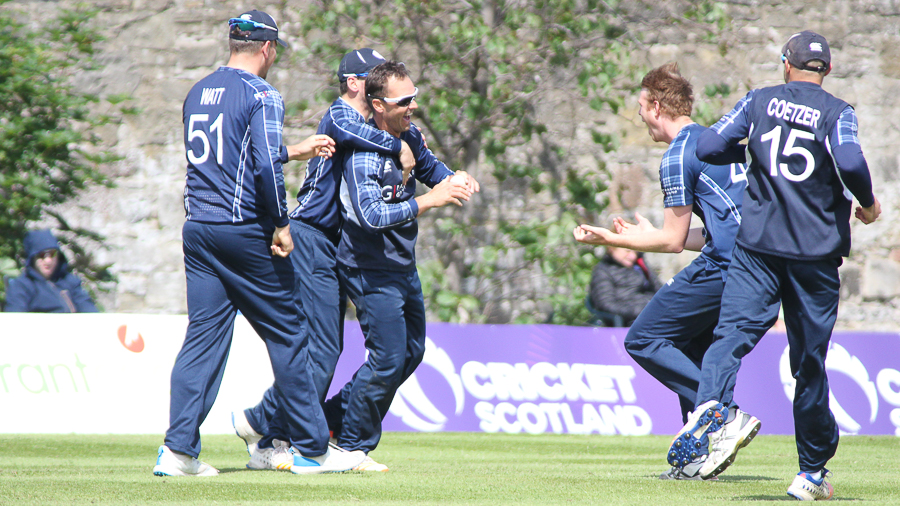 Con de Lange gets mobbed after a stunning catch to remove Craig Williams during the ICC WCL Championship between Scotland and Namibia at Edinburgh on Monday.