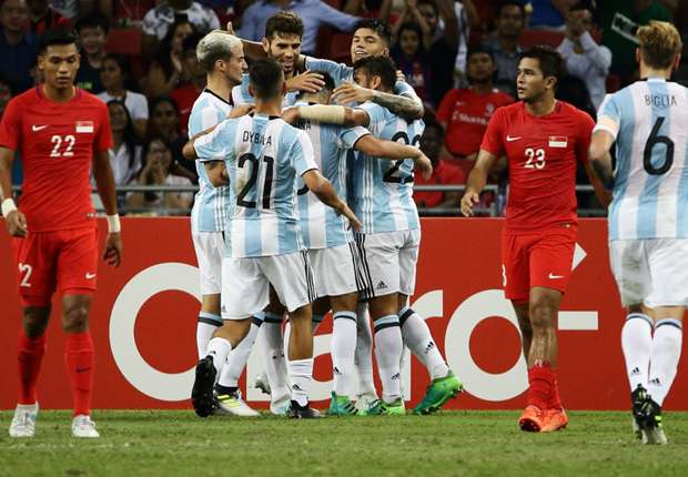 Argentina players celebrate Federico Fazio's goal against Singapore on Monday.