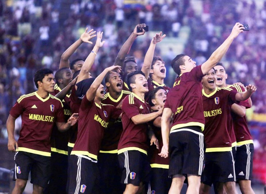 Venezuela's U-20 soccer players take a selfie during a welcome home ceremony at University Stadium in Caracas, Venezuela on Tuesday. The team finished second at the FIFA U-20 World Cup Korea 2017, played in South Korea.