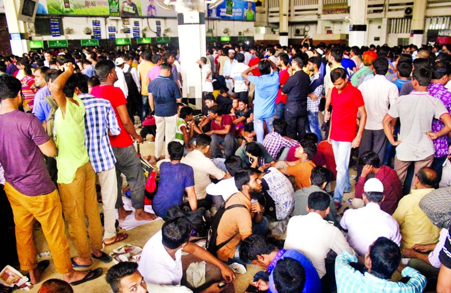 Queued up home-bound people crowded the Kamalapur Railway Station counters awaiting advance tickets for celebrating Eid with their near and dear ones. This photo was taken on the 3rd consecutive day on Wednesday.