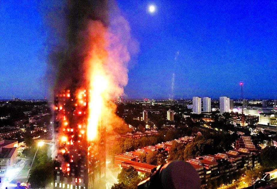 A huge fire engulfs the 27-storey Grenfell Tower in west London.