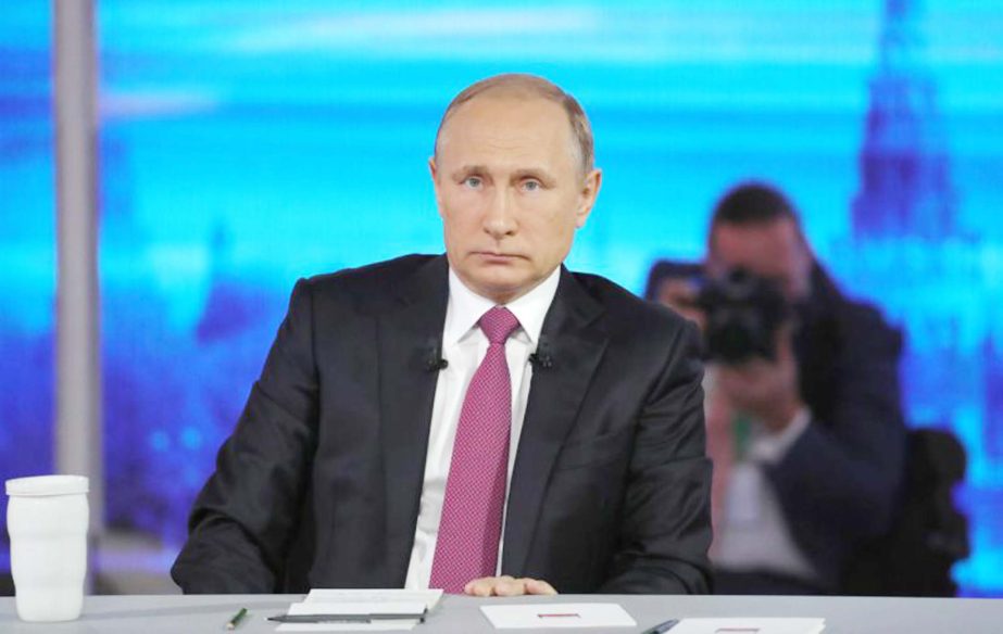 President Vladimir Putin listens during his annual televised call-in show in Moscow on Thursday.
