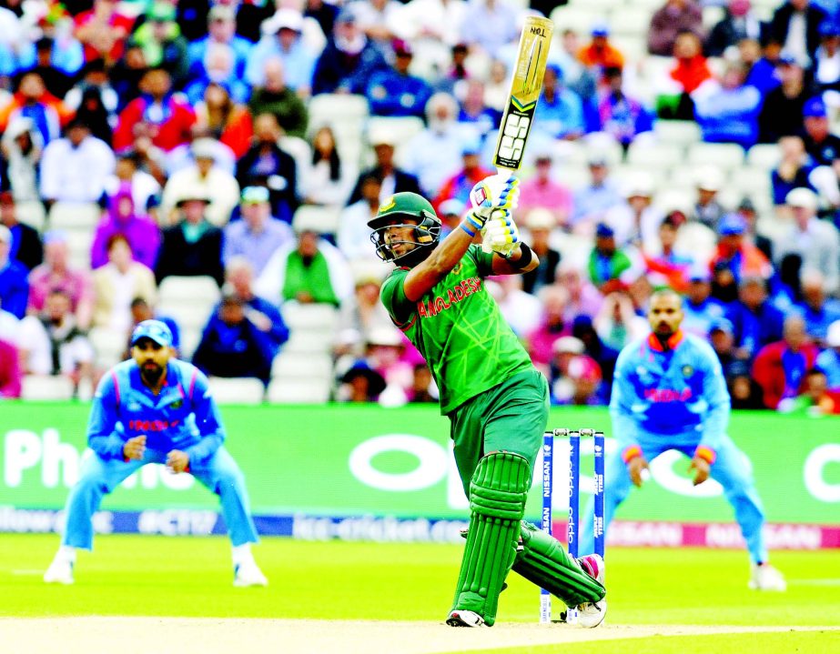 Sabbir Rahman hits the ball to the boundary during the ICC Champions Trophy semifinal match between Bangladesh and India at Edgbaston in Birmingham, England, Thursday,