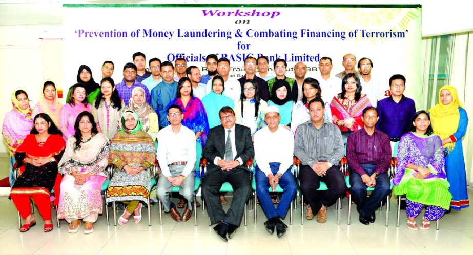 Kanak Kumar Purkayastha, DMD of BASIC Bank Limited, poses with the participants of a day-long workshop on 'Prevention of Money Laundering and Combating Financing of Terrorism' for officials at its Training Institute in the city recently. 40 officials of