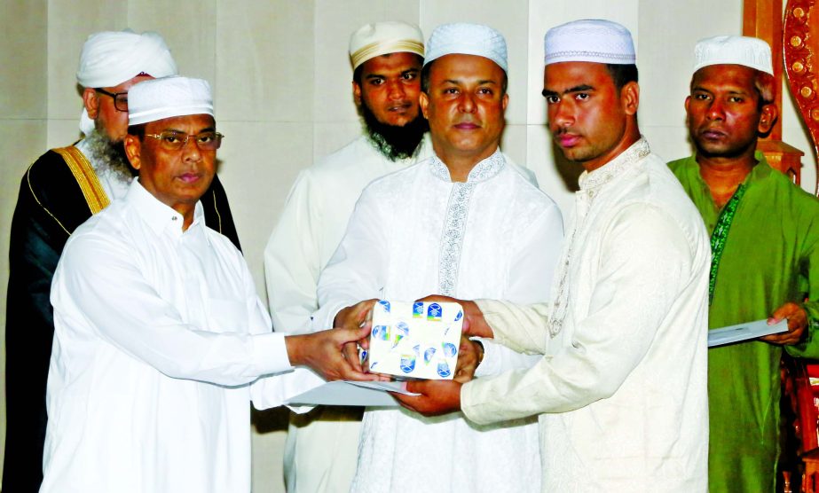 IGP AKM Shahidul Haque distributing certificates and prizes among the winners of annual Azan, Qirat and Essay competition of Bangladesh Police at Rajarbagh Police Lines Central Jame Mosque in the city on Friday.