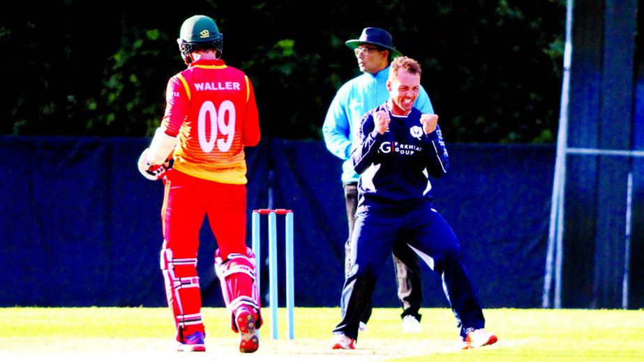 Con de Lange of Scotland celebrates his fifth wicket after Malcolm Waller is caught on the boundary during the 1st ODI between Scotland and Zimbabwe at Edinburgh on Thursday.