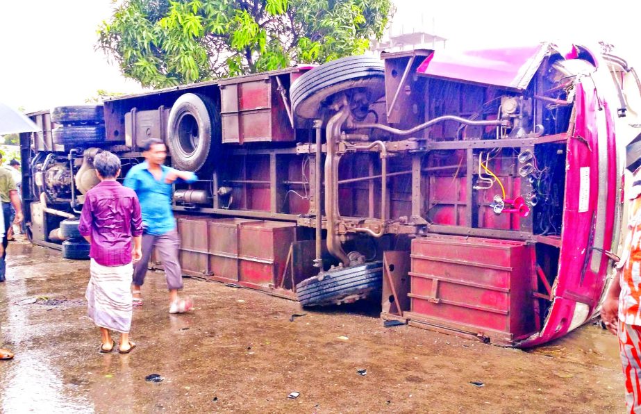 Two people were killed and 15 injured as Ekushey Express AC bus overturned and fell into a ditch near Saddam Market area on Dhaka-Chittagong Highway on Friday.